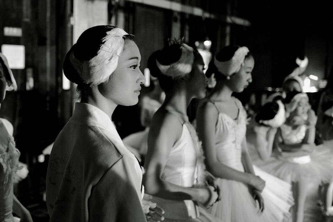 Fashion models backstage preparing for a runway show