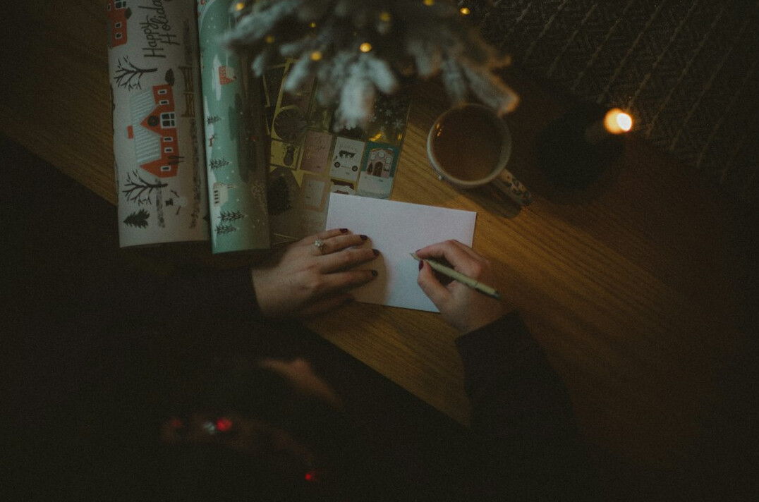 person writing letter