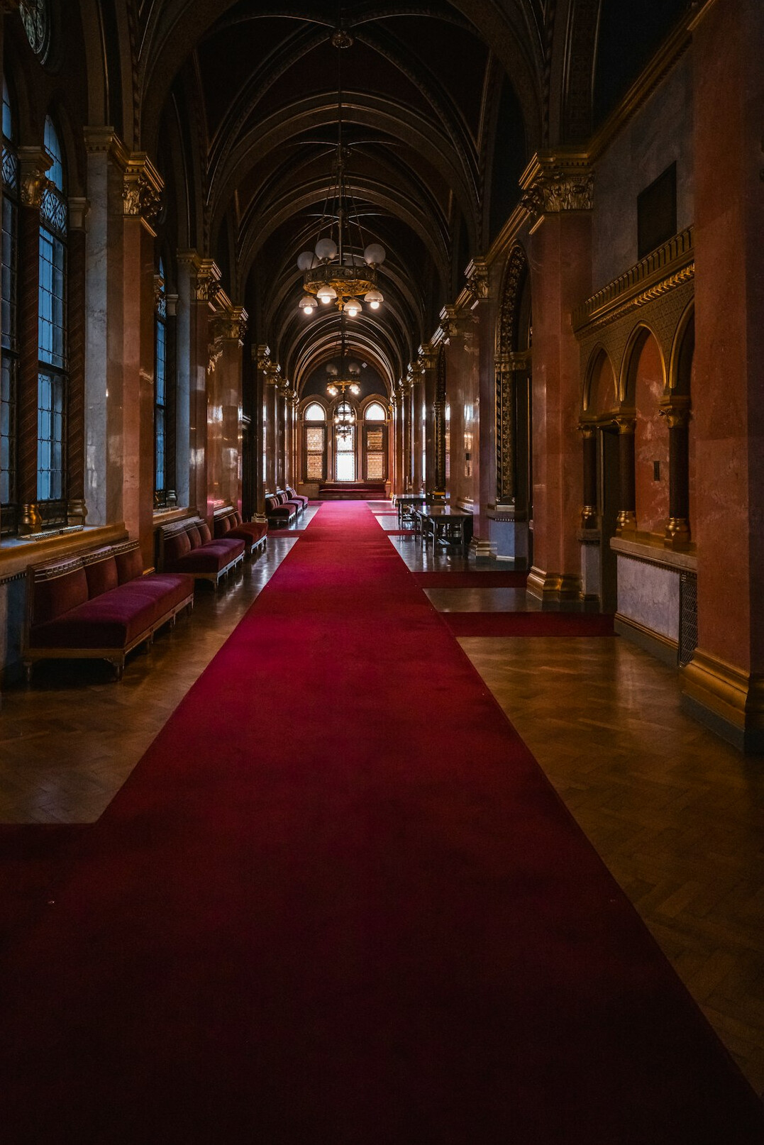Glamorous celebrity on a red carpet under bright flashing lights